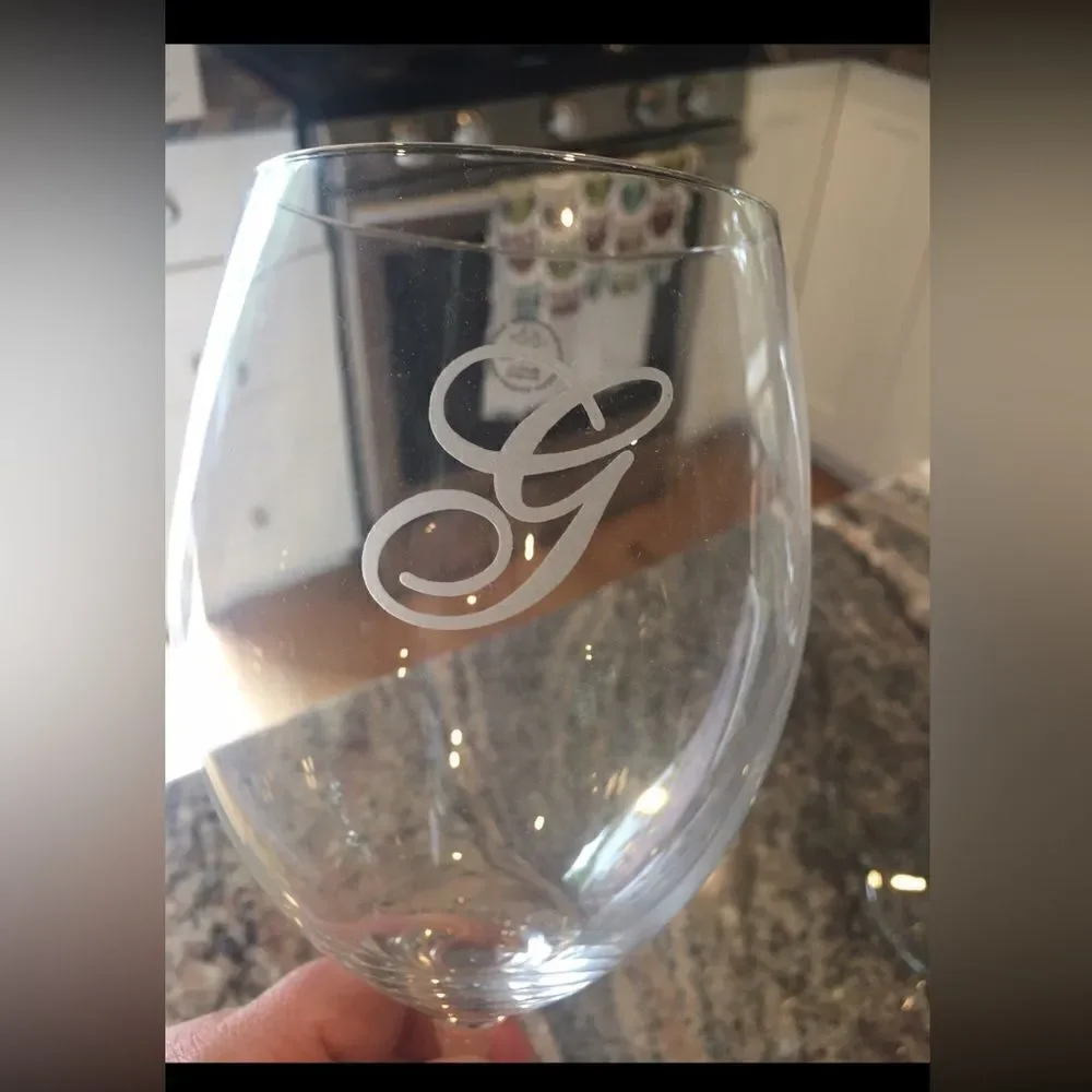 Long stem crystal wine glasses with G monogram